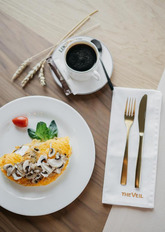 The Veil Hotel Astana Exterior foto A place setting with a napkin